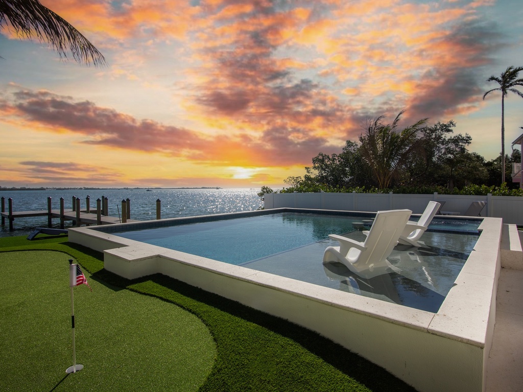 Private pool, putting green, and waterfront dock