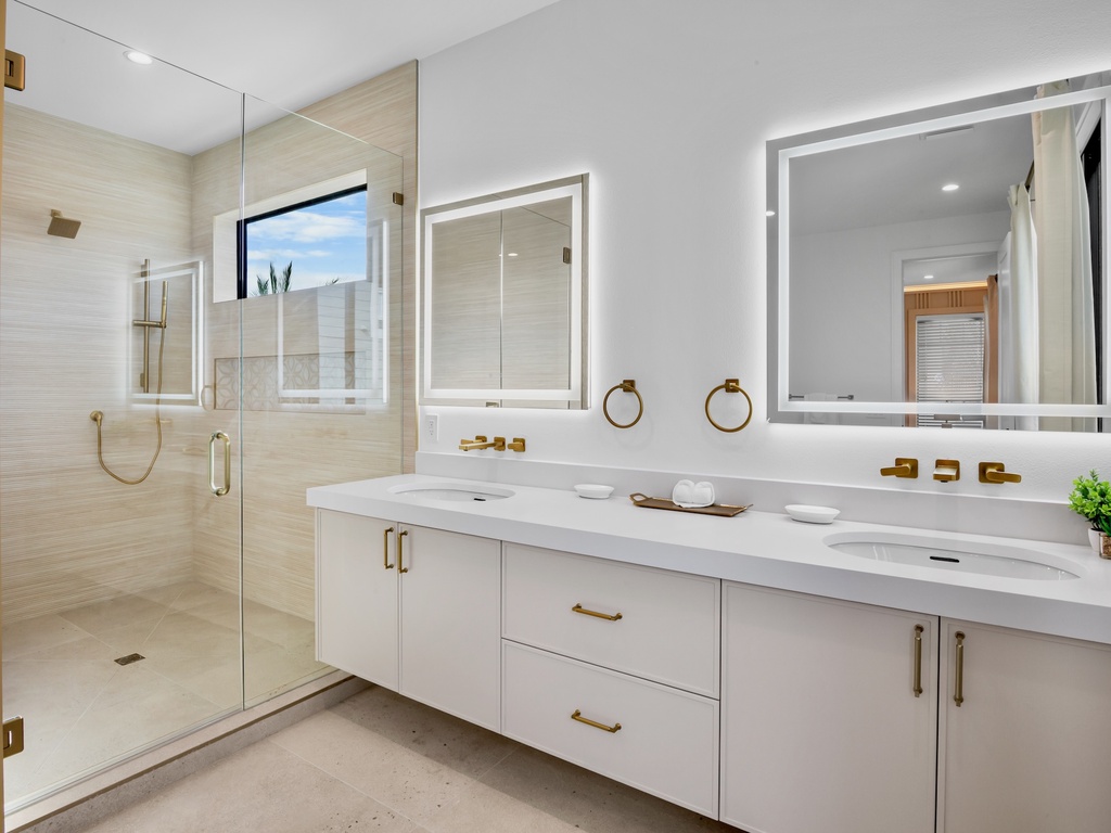 Primary bathroom with walk-in shower and standalone soaking tub