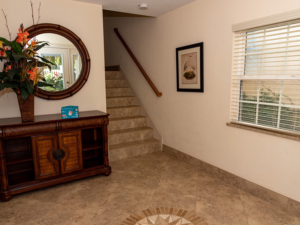 Main Foyer with access upstairs, the game room or pool