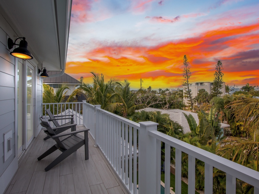 Sunset views paint the sky in vibrant colors from your private balcony