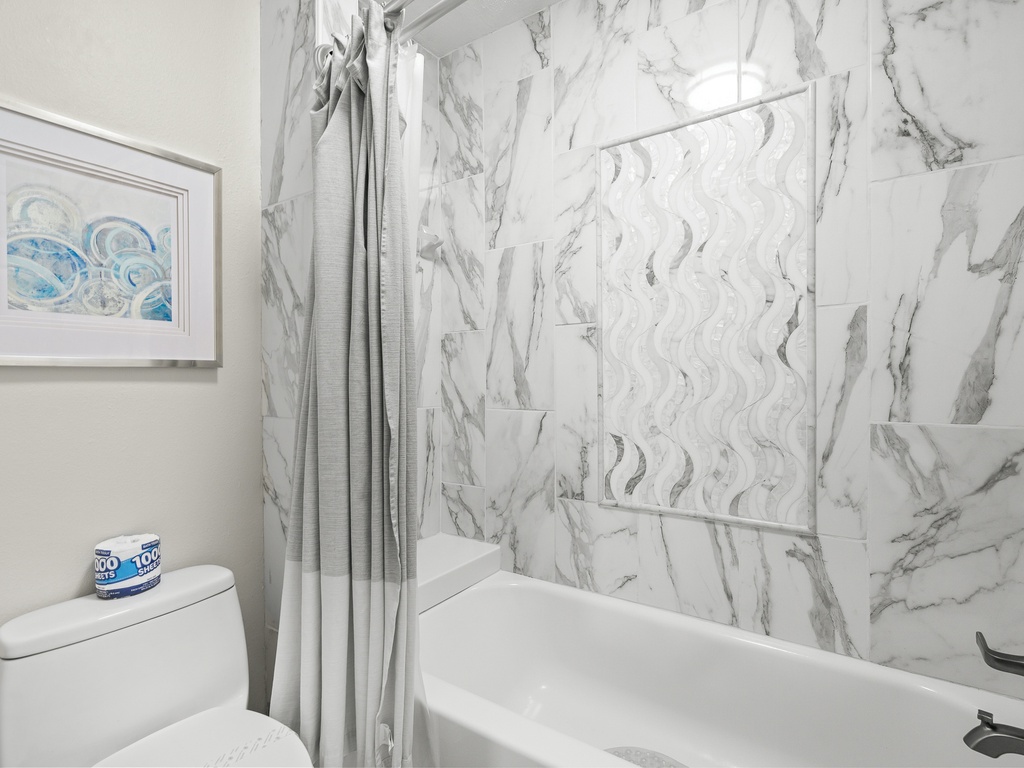 Shared Bathroom with Shower/Tub Combination