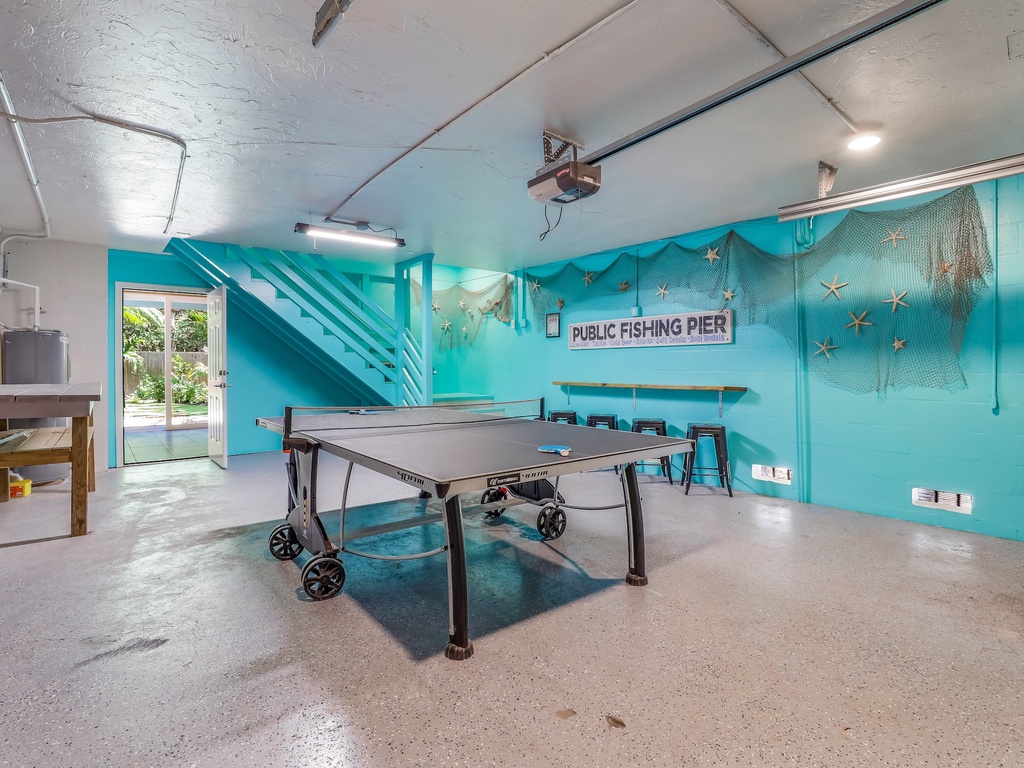 Your private game room awaits with ping pong fun, nautical charm, and seaside vibes for memorable evenings together.