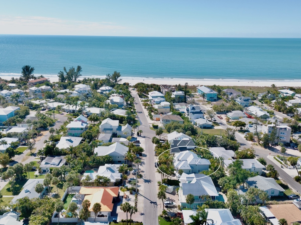 Aerial view of coastal home near the beach