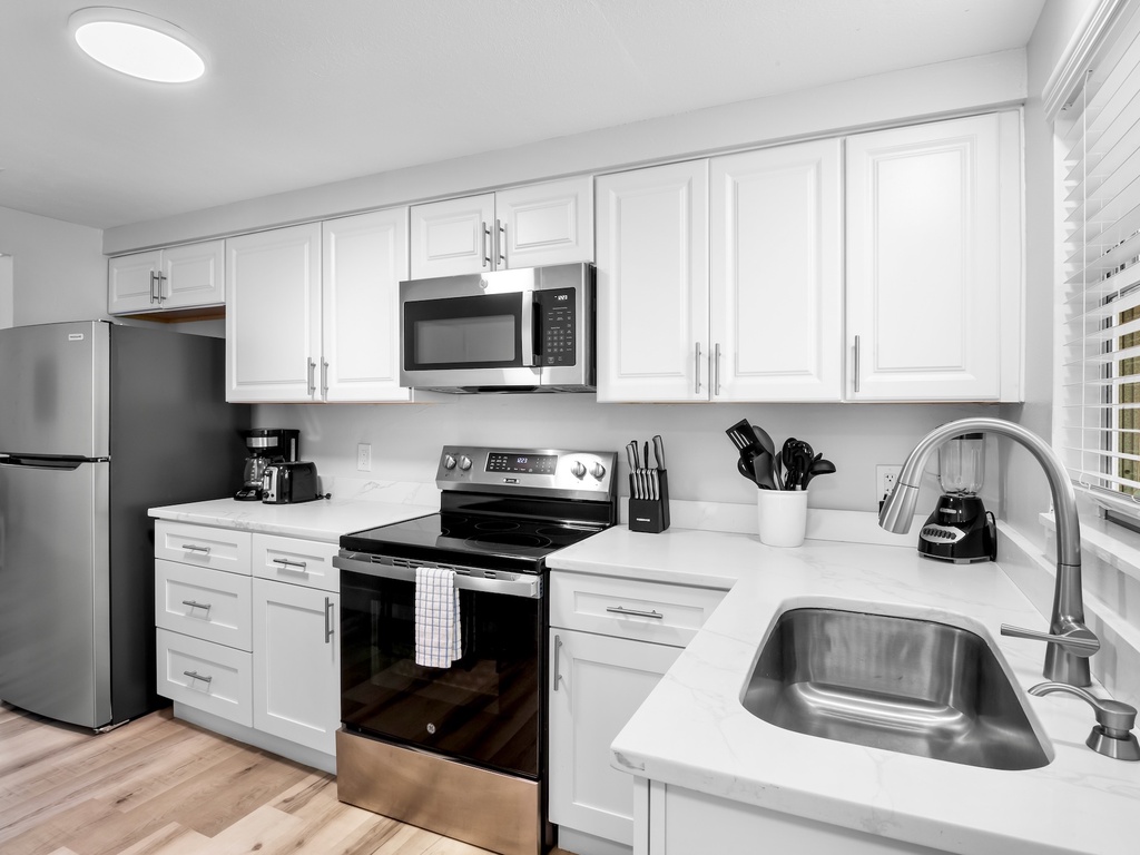 Fully equipped kitchen with dining space for meals.