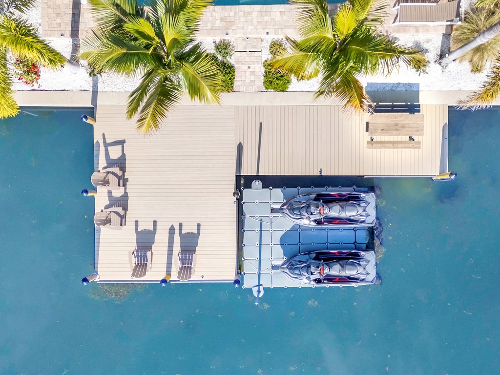 Waterfront property features private dock