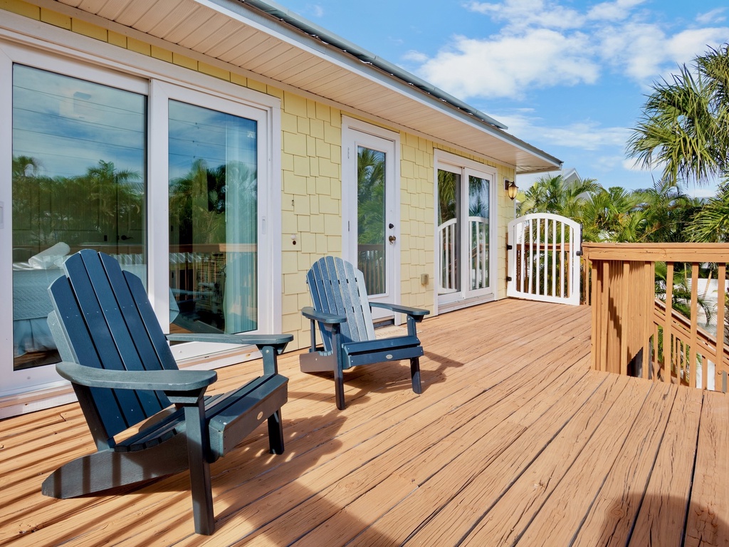 Private deck with classic Adirondack chairs