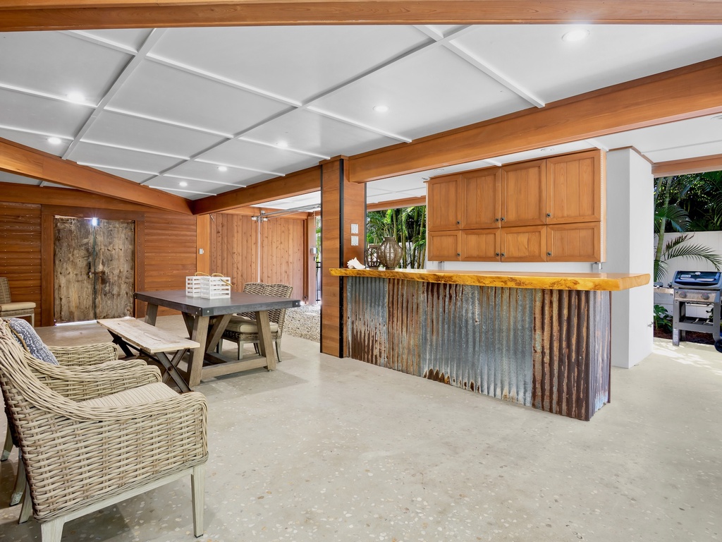 Covered outdoor kitchen with comfortable seating