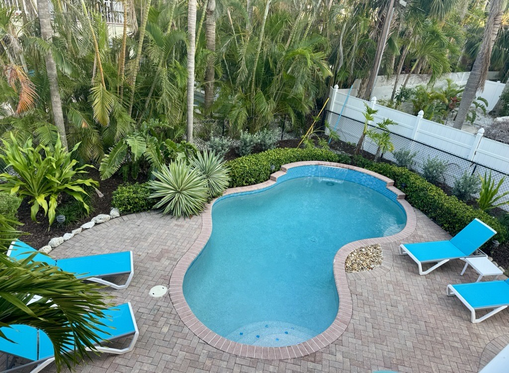 Private Heated Pool With Lush Tropical Landscaping