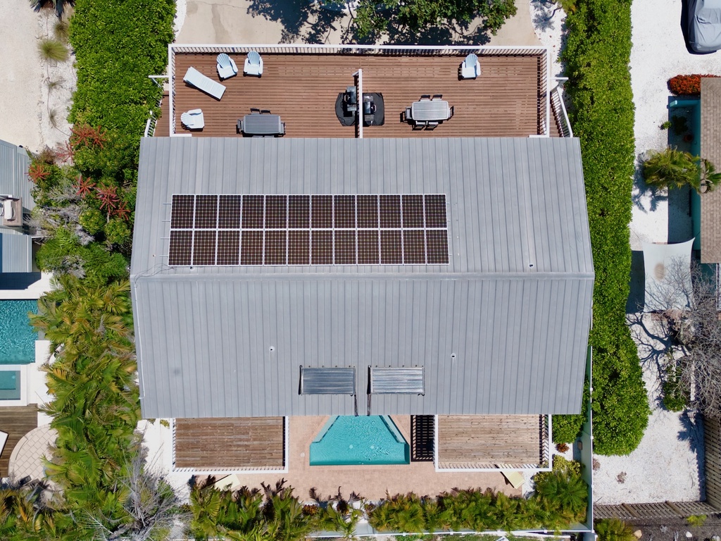 Drone view of house and pool