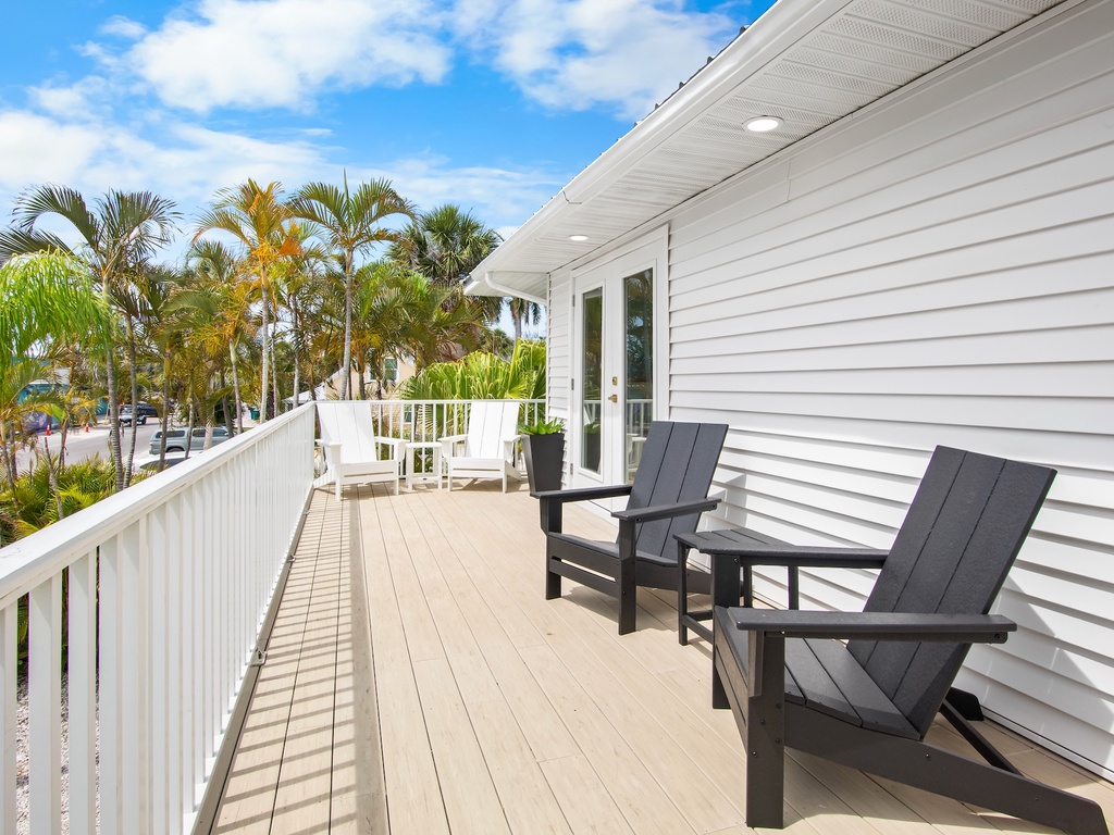 Outdoor deck with Adirondack seating and tropical views