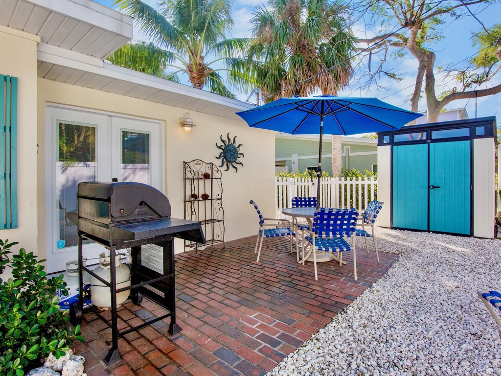 Enjoy outdoor dining and grilling in your private patio space, complete with BBQ facilities, comfortable seating, and tropical charm.