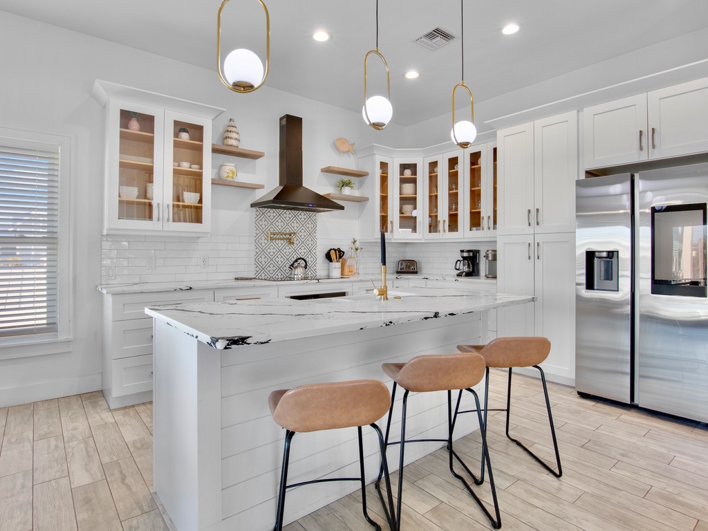 Chef's kitchen with marble island and appliances - 2nd floor