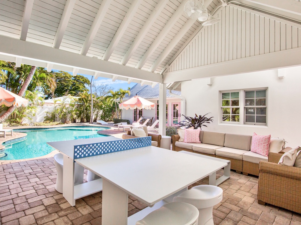 Relax in your covered poolside pavilion with comfortable seating, ping pong, and direct access to the pool