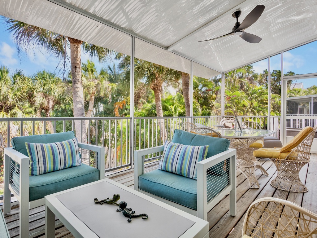 Screened lanai with outdoor dining and lounge seating