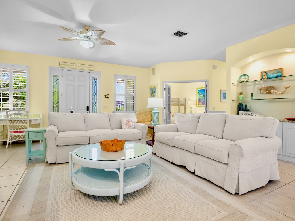 Bright Living Area with Cozy Seating and TV