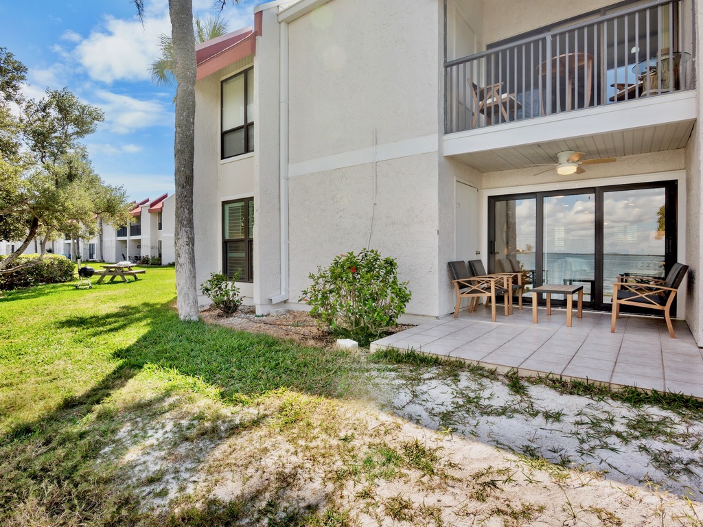 Waterfront home with private patio seating area
