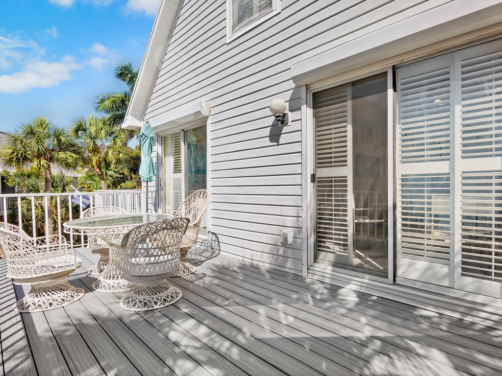Outdoor dining space with tropical surroundings