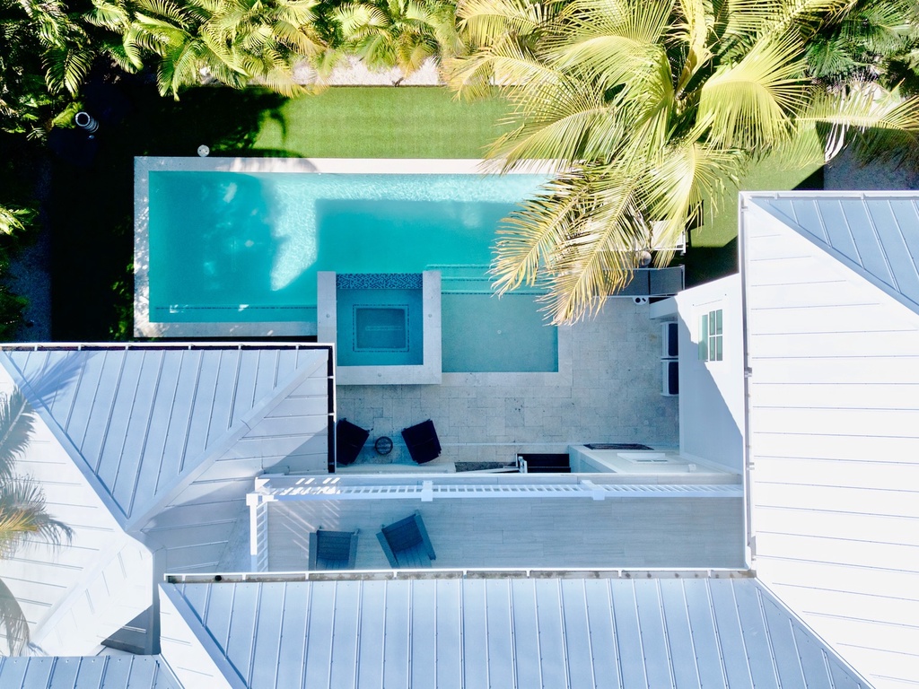 Aerial view of home with private pool and spa