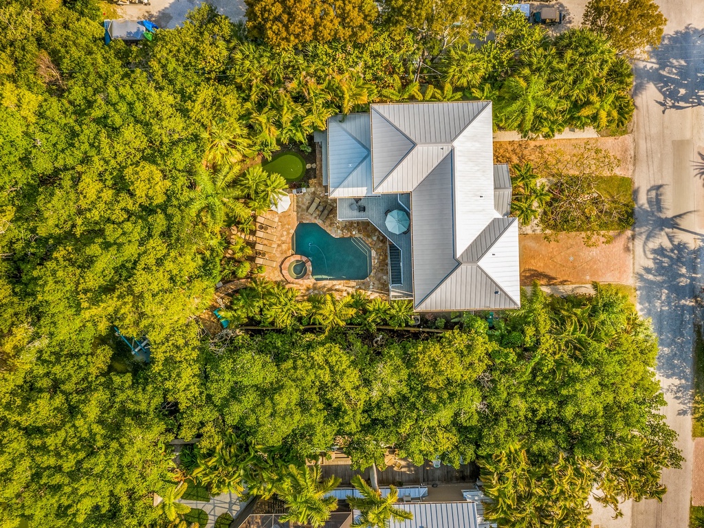 Stunning beachfront villa surrounded by lush tropical gardens, featuring private pool and direct beach access for the perfect island getaway.