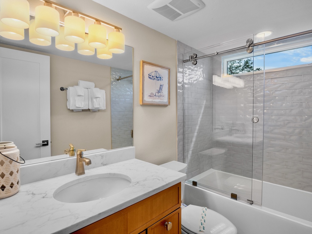 Second bathroom with tub and shower combo