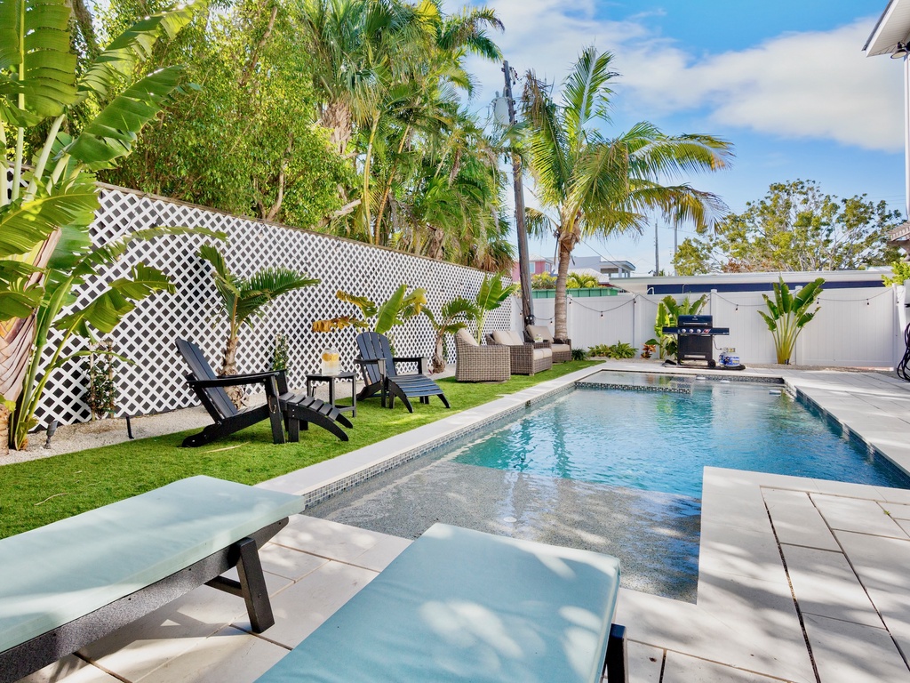 Tropical oasis with a pool and comfortable loungers