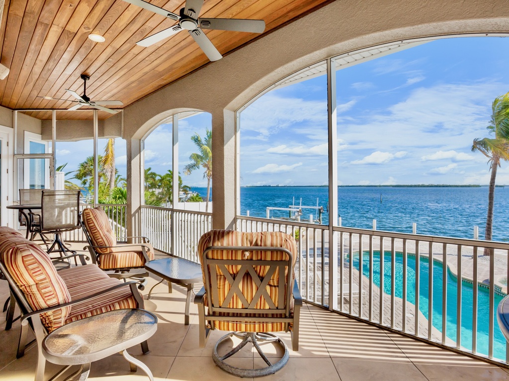 Balcony with dining table and chairs