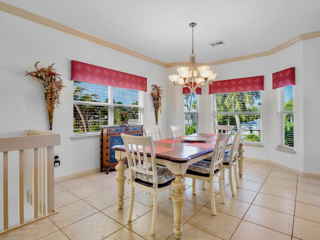 Gather around this elegant dining table for memorable meals with loved ones in your bright, welcoming dining space.