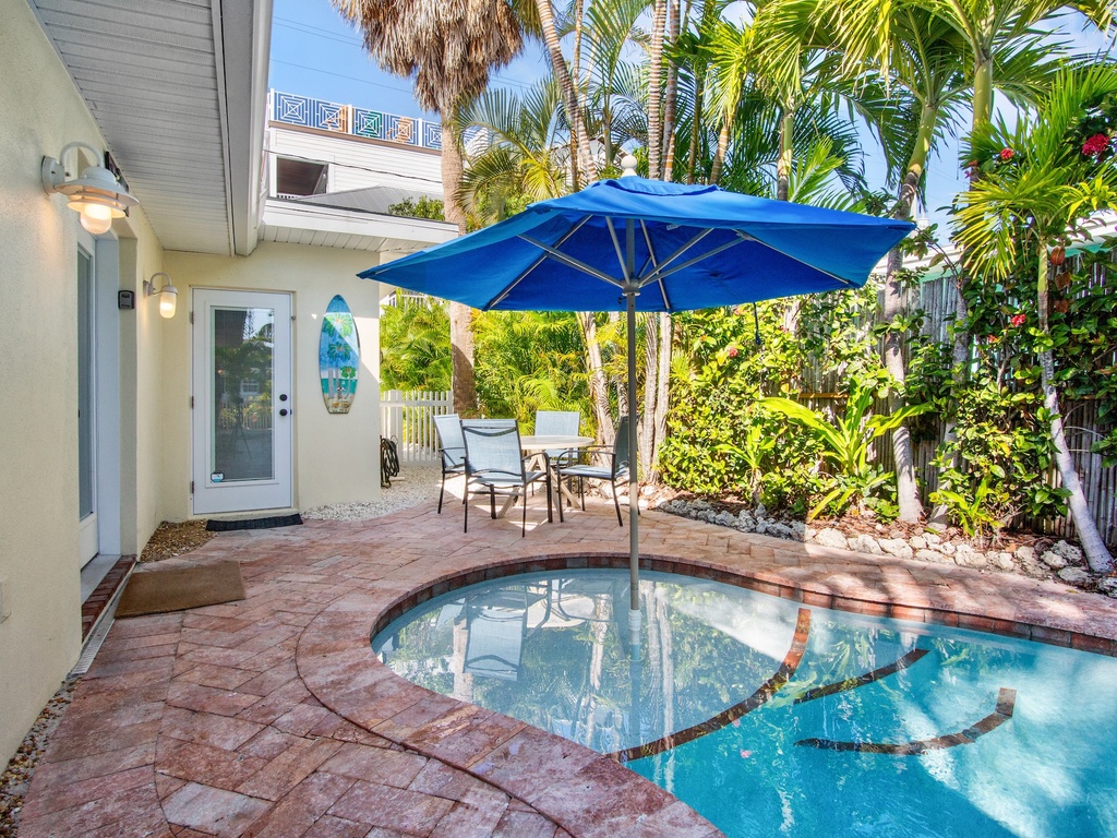 Your private pool oasis awaits with tropical landscaping for ultimate relaxation