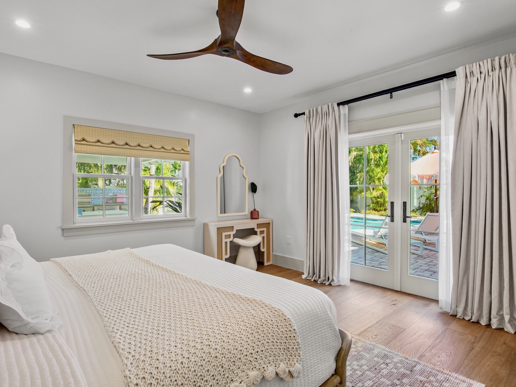 Primary bedroom with pool access, King bed
