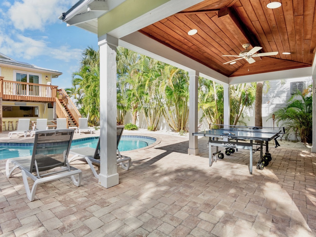 Private covered patio with ping-pong table