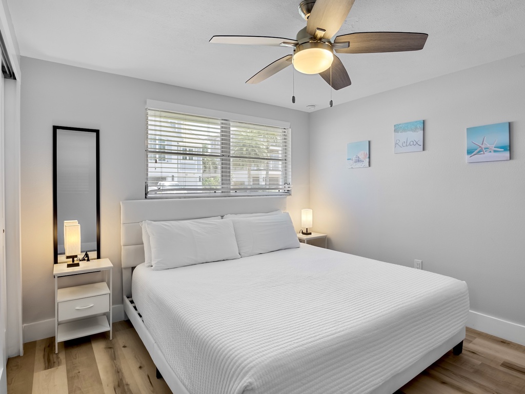 Spacious primary bedroom with king bed.