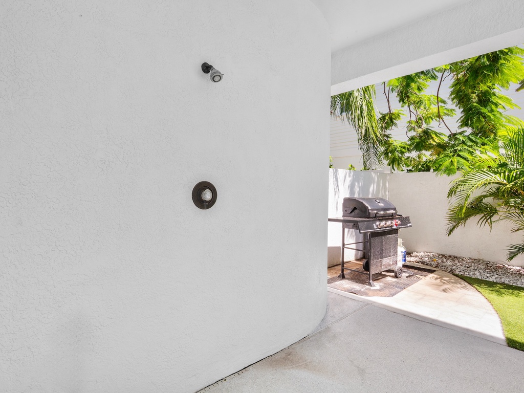 Refreshing outdoor shower for guests and BBQ grill