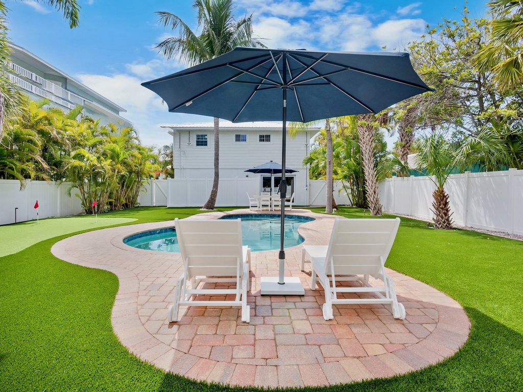Backyard Entertainment Area with Pool & Dining