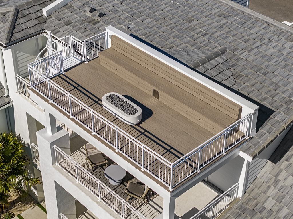 Rooftop terrace with modern fire pit and outdoor seating