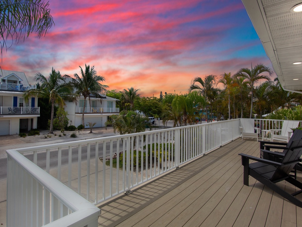 Outdoor deck with Adirondack seating and tropical views