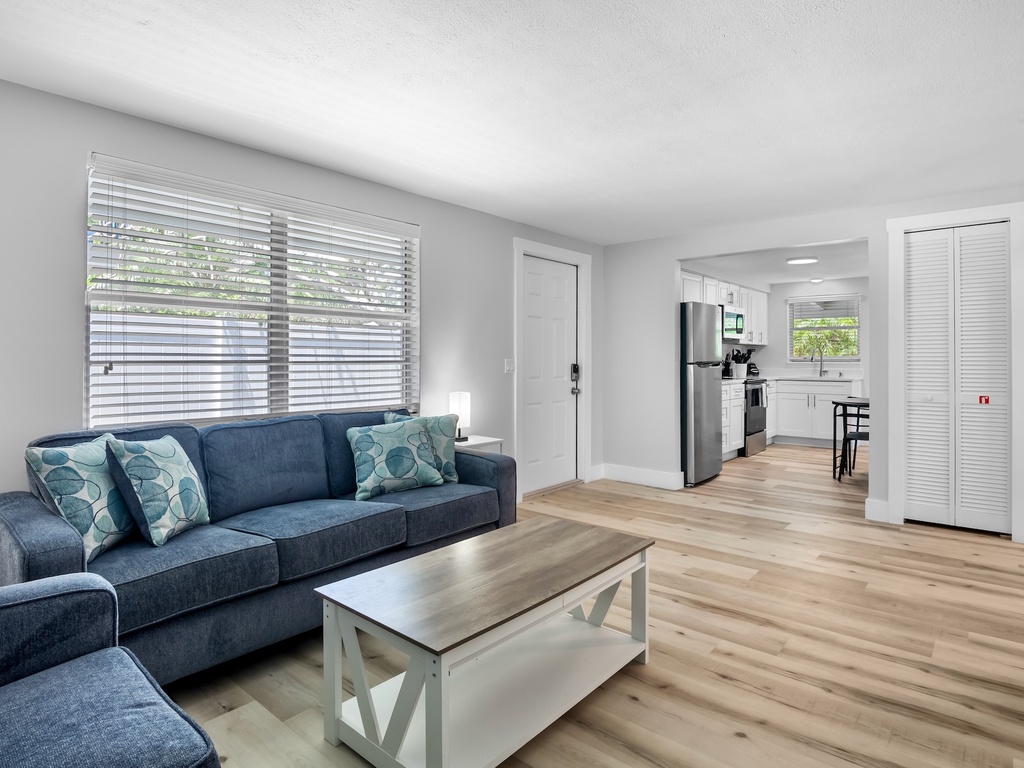 Open living space with comfortable seating and easy access to the kitchen.