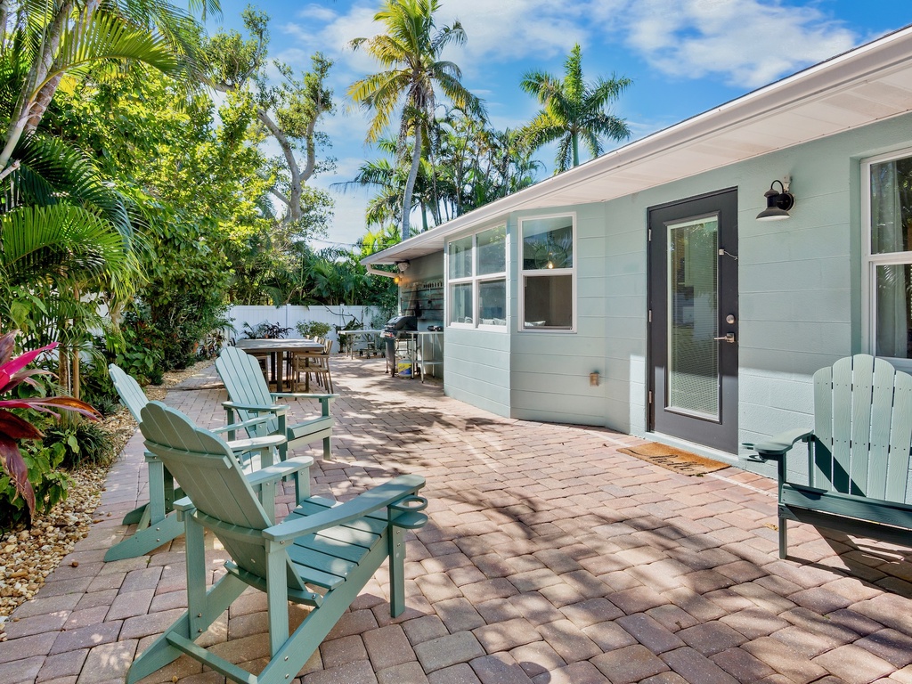 Private patio with adirondack chairs