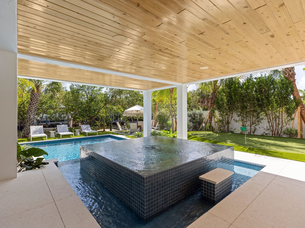 Covered Pool Lounge and Putting Green