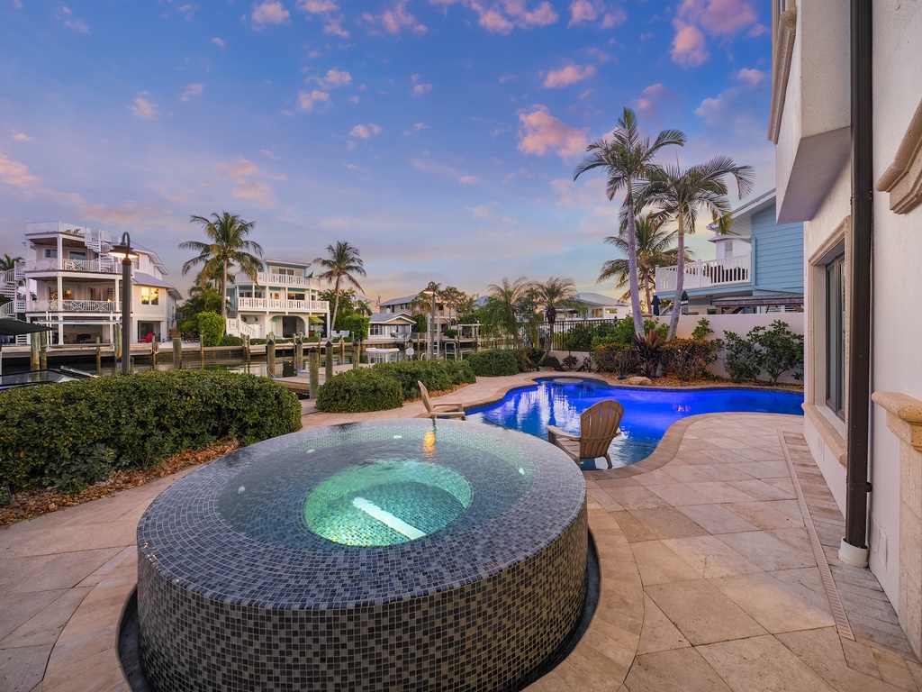 Private pool and spa surrounded by tropical palms