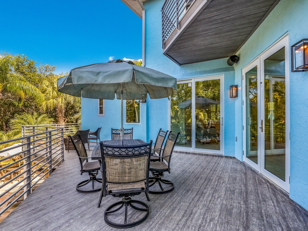 Step onto your private terrace where comfortable seating and tropical views create the perfect spot for morning coffee or evening conversations under the stars.