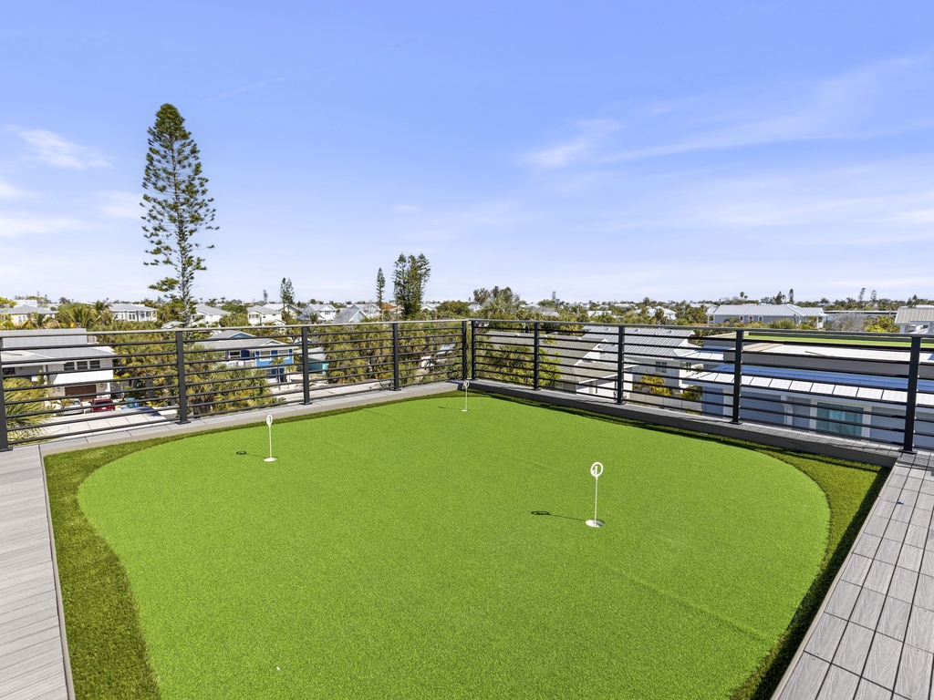 Rooftop deck with putting green and gulf views