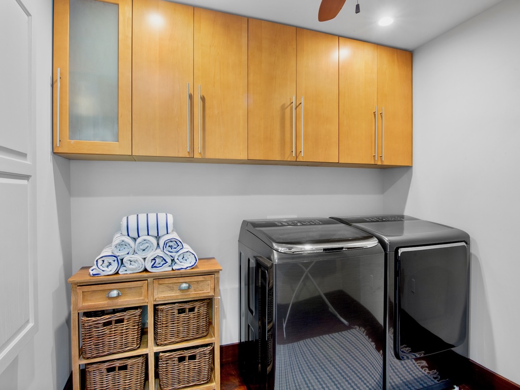 Private laundry room with washer and dryer
