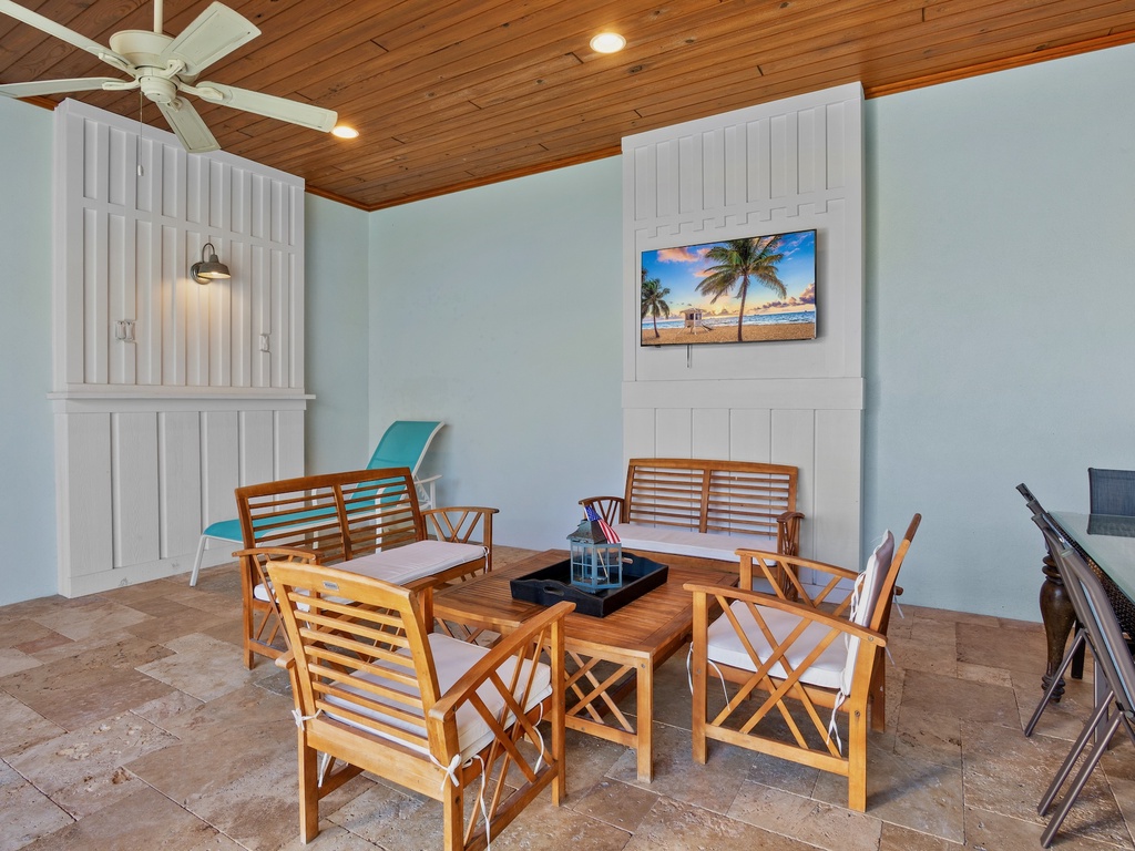 Outdoor dining area with TV