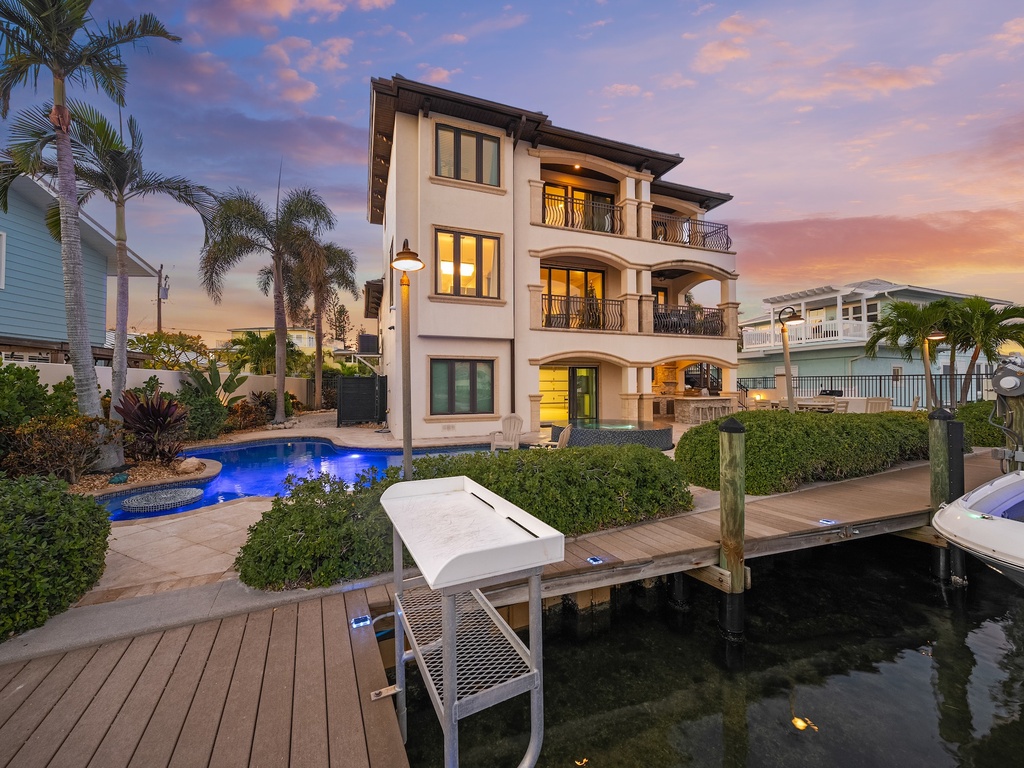 Waterfront villa with private dock, pool, and tropical gardens