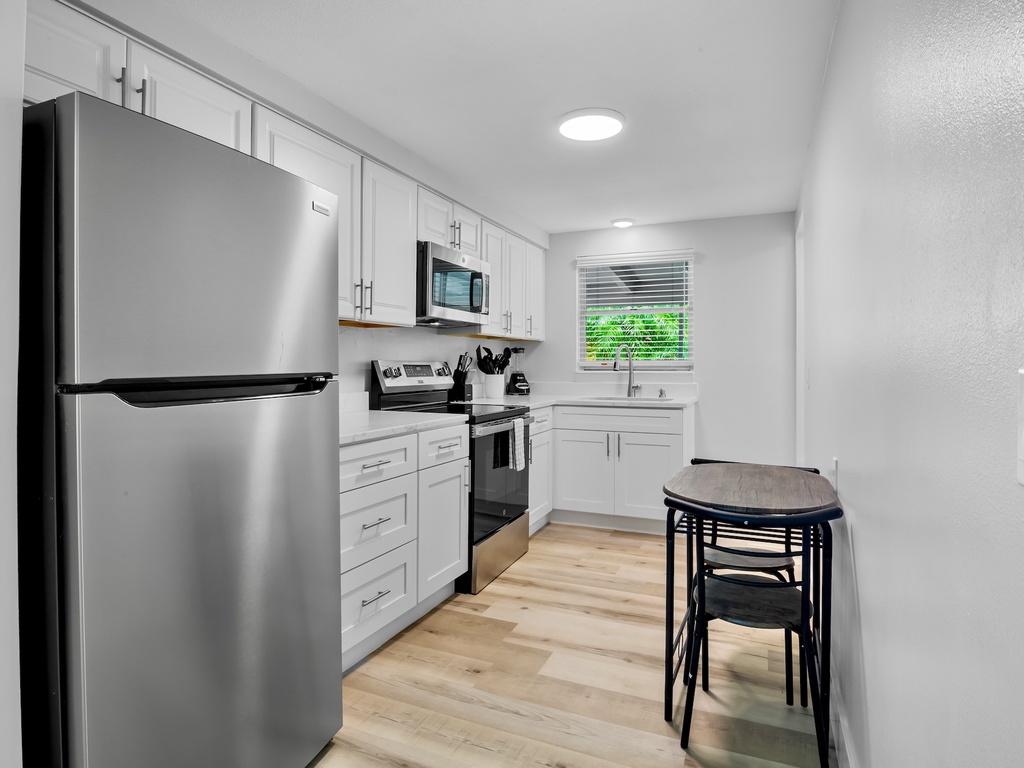 Fully equipped kitchen with dining space for casual meals.