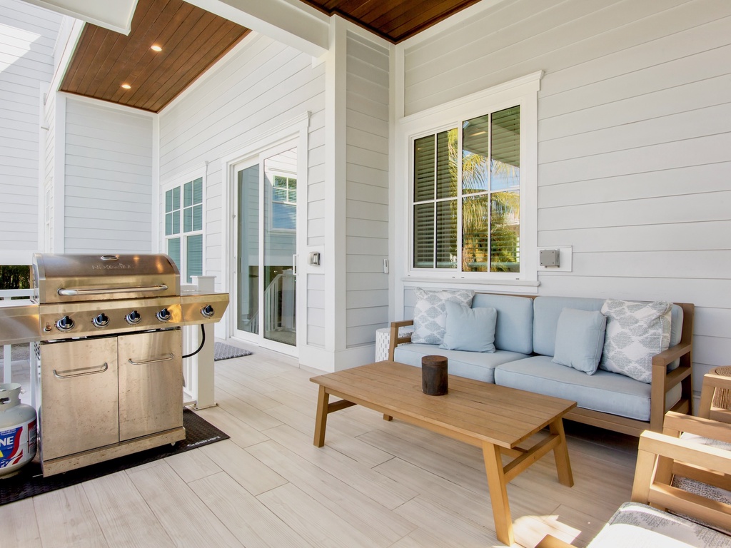 Unwind on your private covered patio with comfy seating and BBQ grill