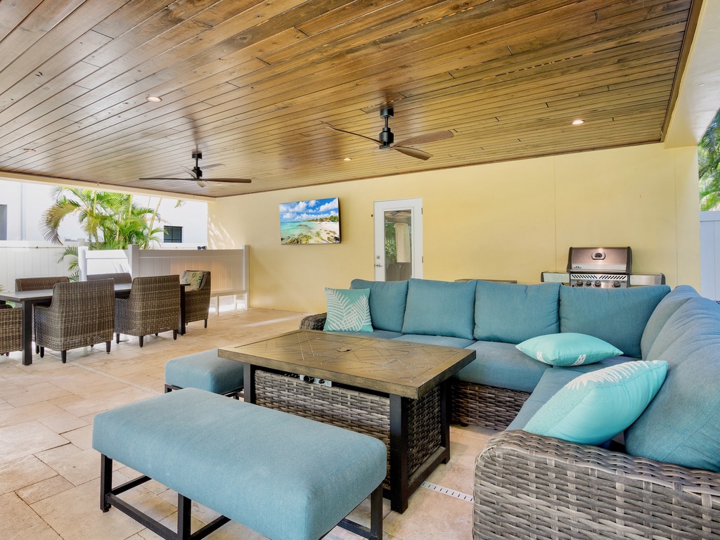 Outdoor living space with cozy seating and BBQ