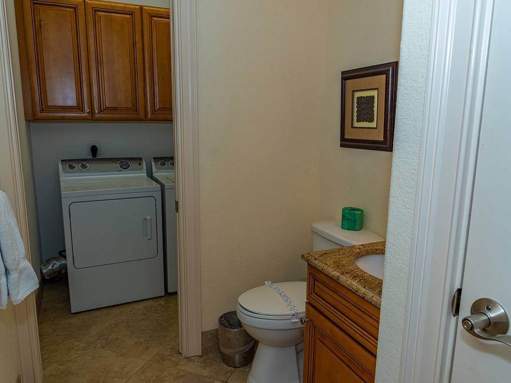 Guest bath on main floor with access to laundry room
