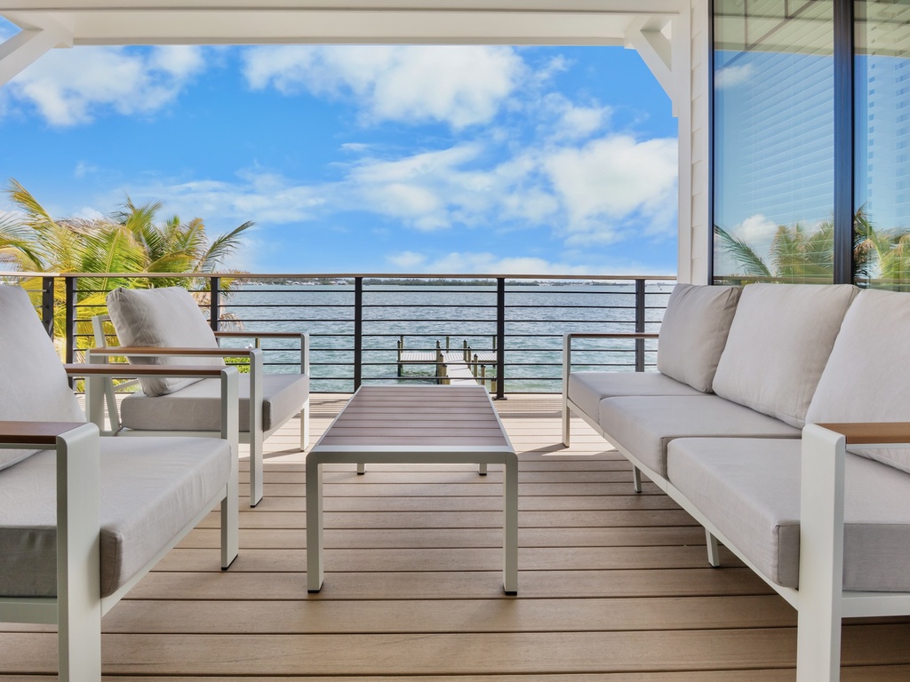 Private balcony with plush seating and ocean views