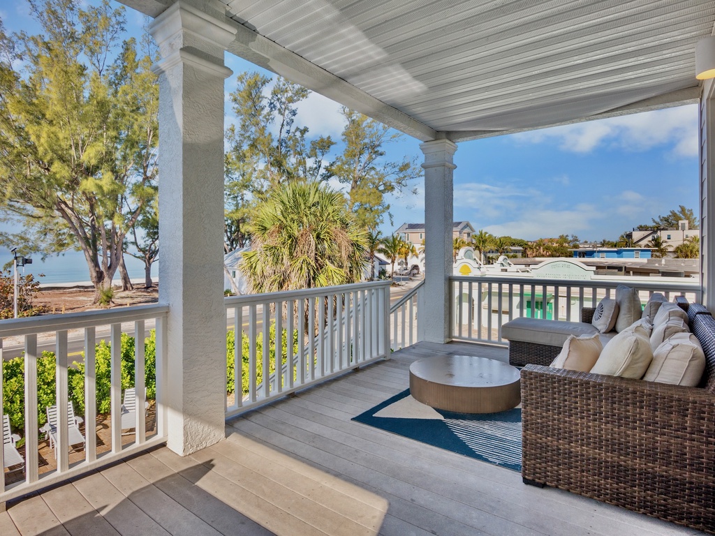Private covered porch with comfortable seating